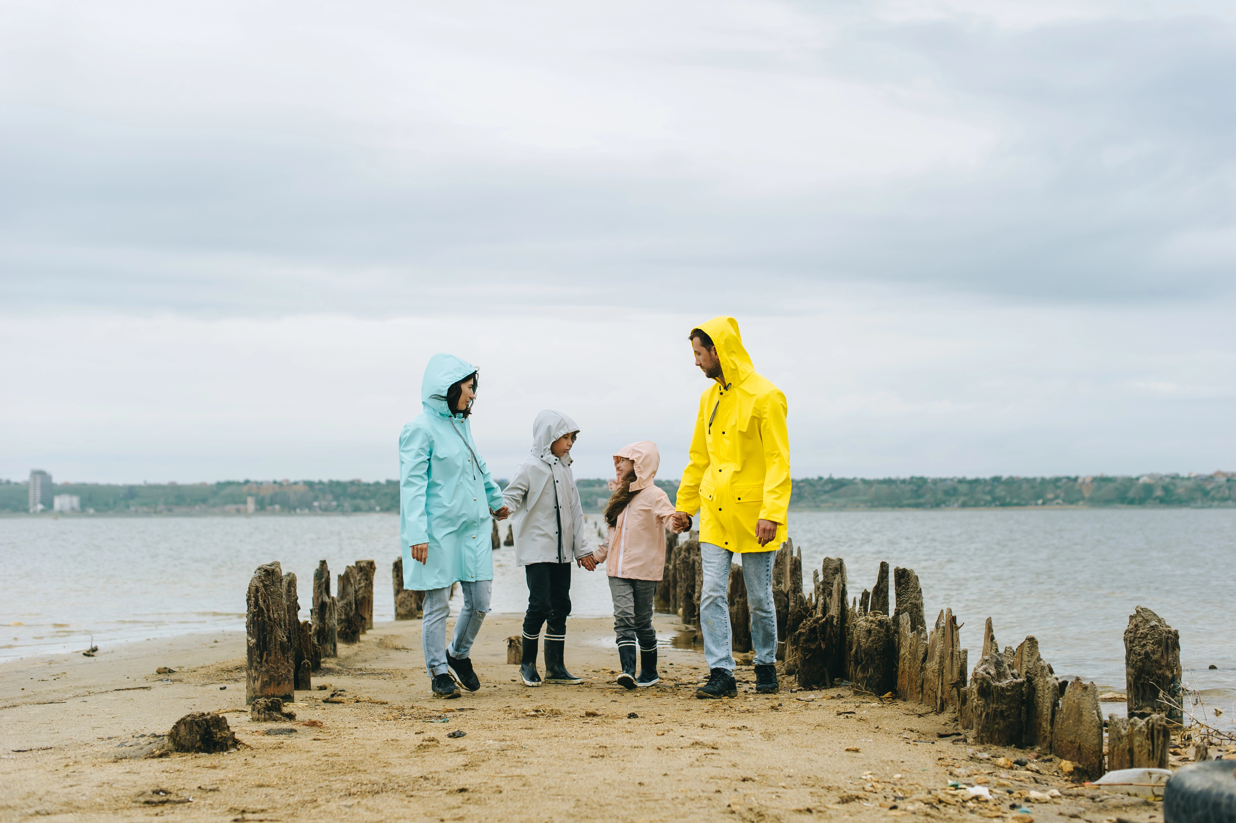 Family at the seaside in bad weather