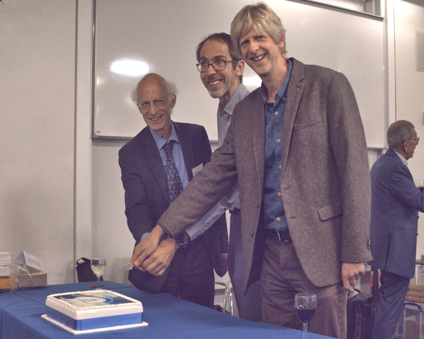 Cutting the cake at QJ 150th Anniversary Event