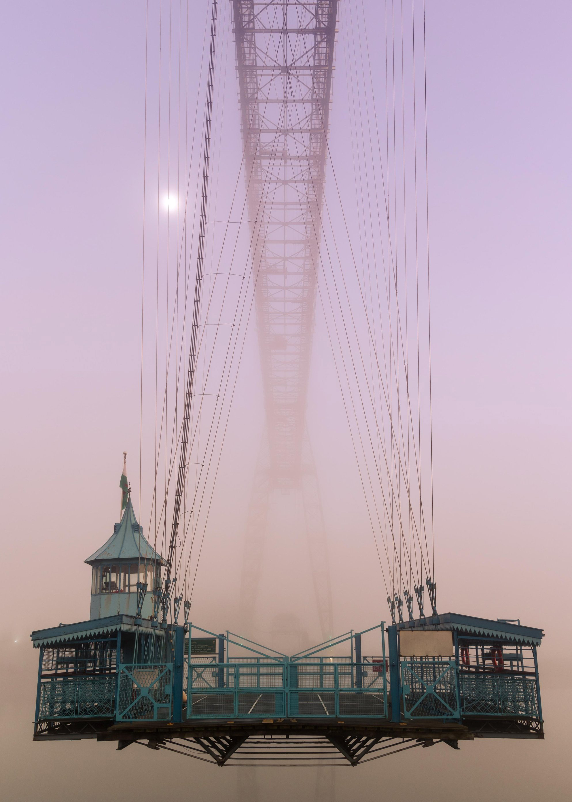 Newport Transporter Bridge bathed in pink fog